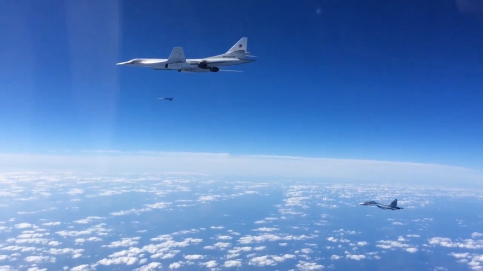A Tu-160 launching a cruise missile, escorted by a Su-30  the stand-off strike role.