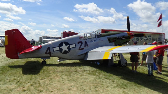 A red-tailed P-51 in Tuskegee Airmen markings  the 332nd Fighter Groups distinctive escort livery.