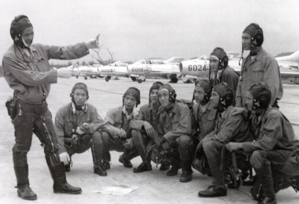 Vietnam Peoples Air Force pilots in front of Shenyang J-6 fighters.