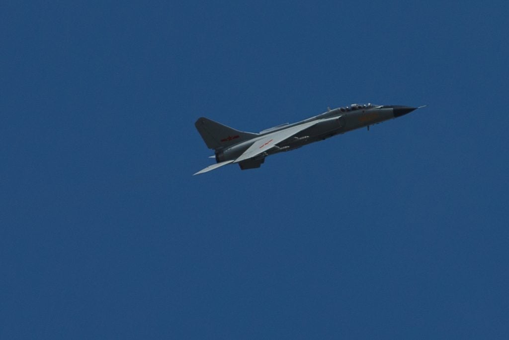 A JH-7A climbing against a clear sky during the Vostok 2018 exercise.