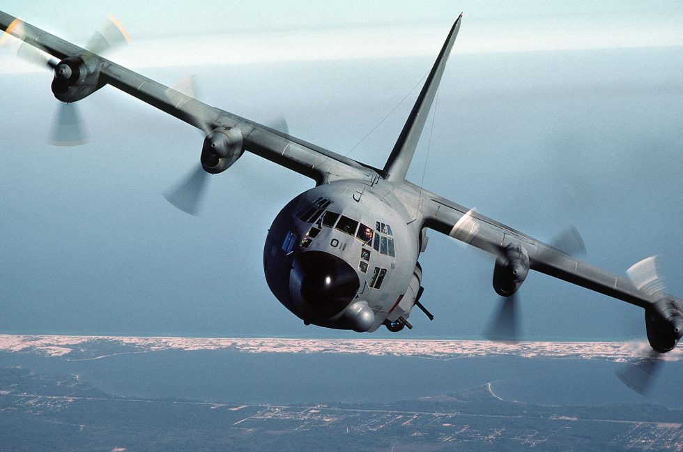 An AC-130A in a banking pylon turn  the left-hand circle that keeps the guns on target.