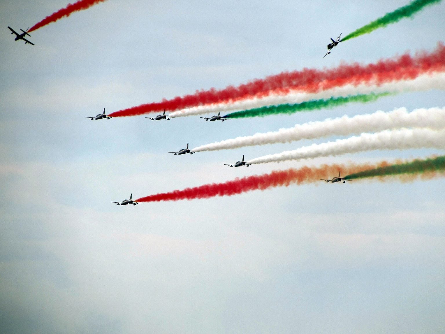 Aermacchi MB-339 jets of the Frecce Tricolori trailing tricolour smoke in flight
