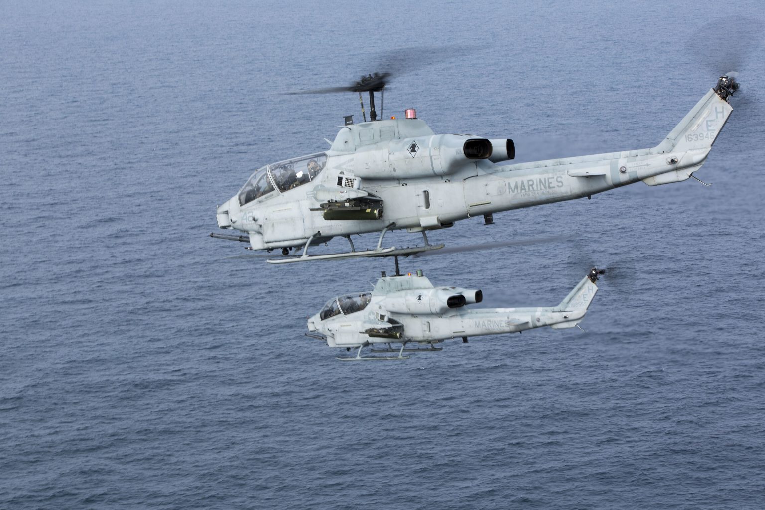Formation of AH-1W Super Cobras over the Atlantic