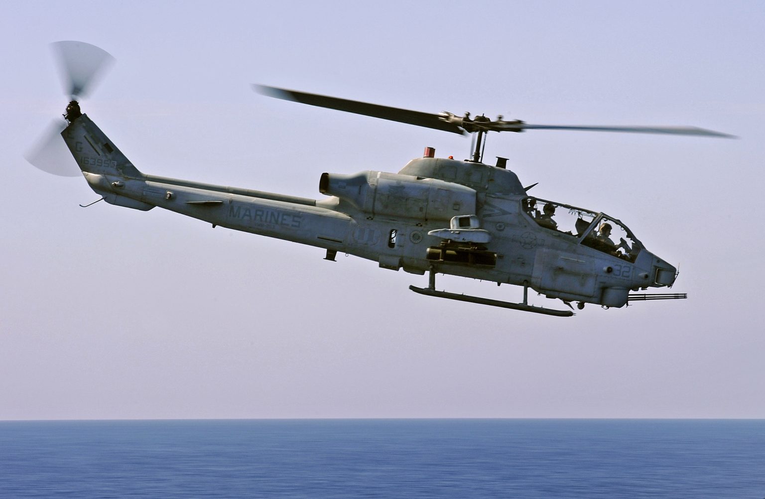 AH-1W SuperCobra flying low over water