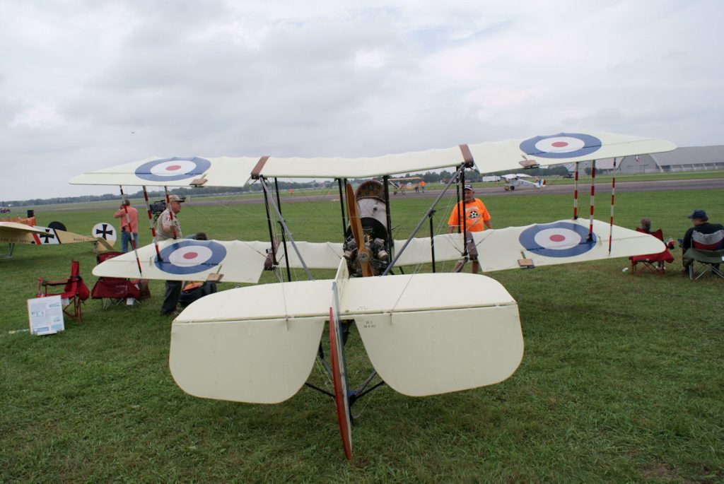Rear view of an Airco DH.2 replica showing the pusher engine and tail booms