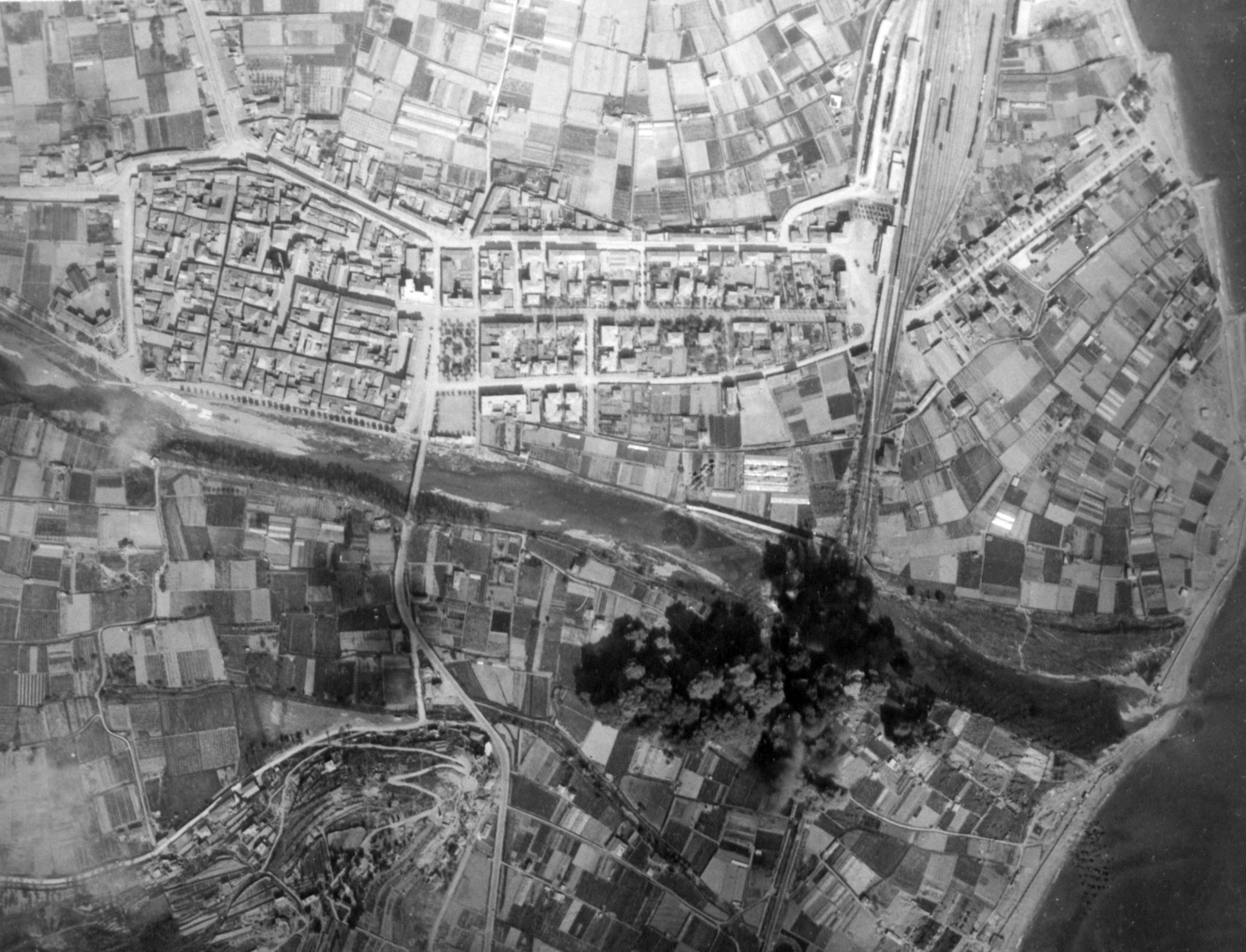 B-26 Marauders of the 320th Bomb Group bombing the Albenga railway bridge in Italy, 1944
