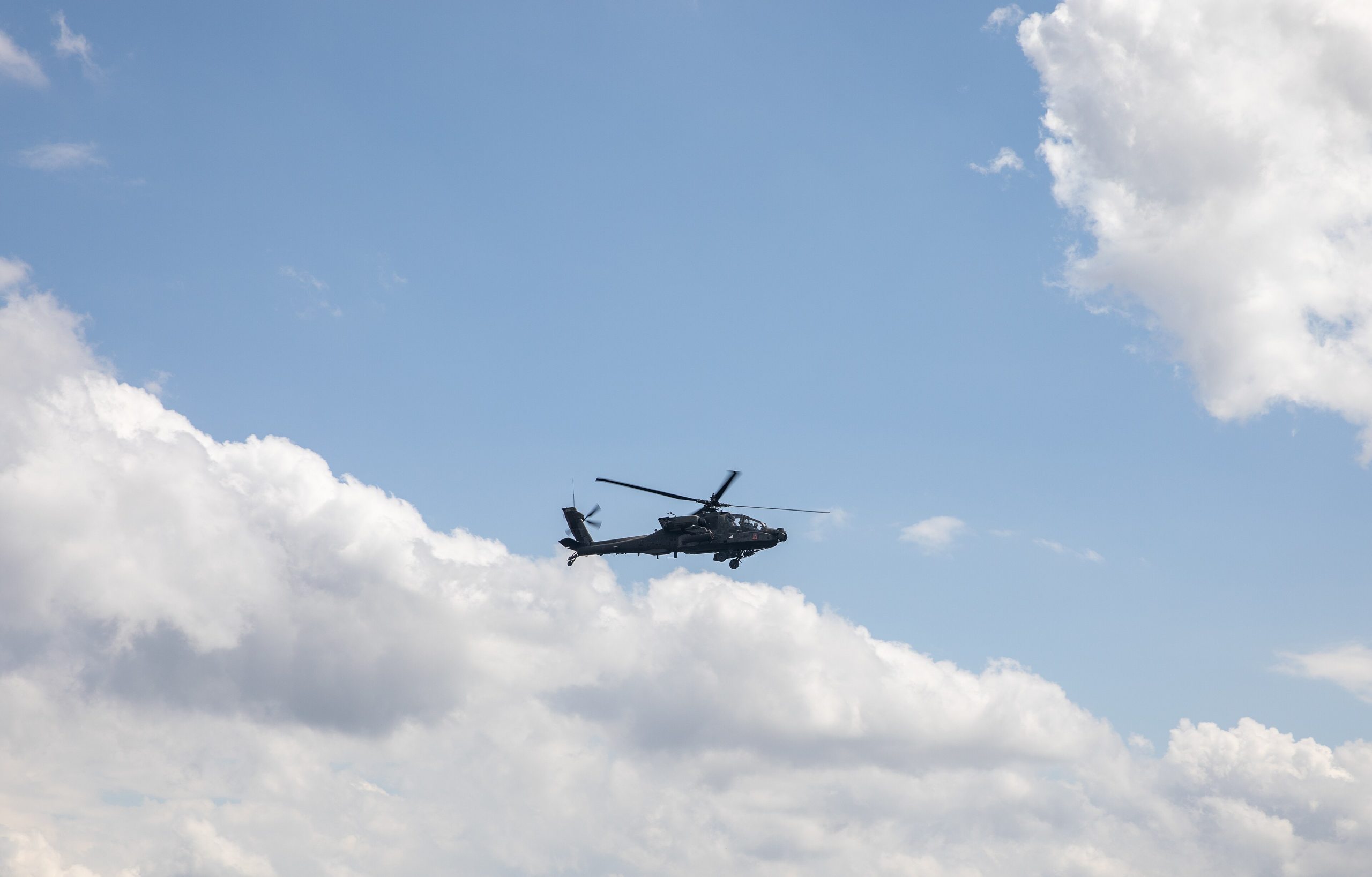 Boeing AH-64 Apache attack helicopter firing during aerial gunnery