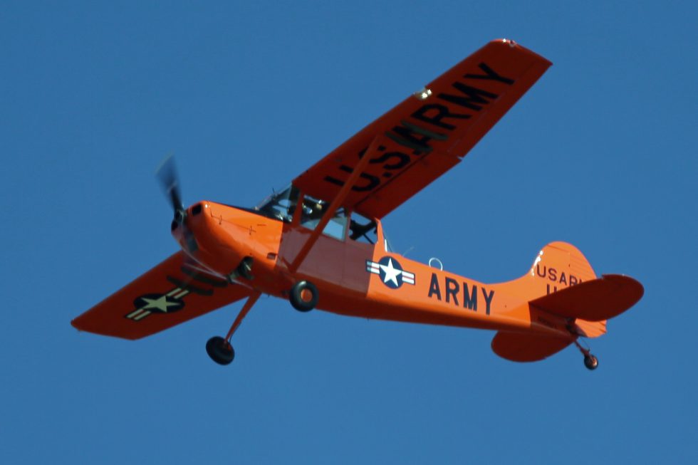 A privately owned O-1 Bird Dog flying today  one of hundreds of surviving warbirds.