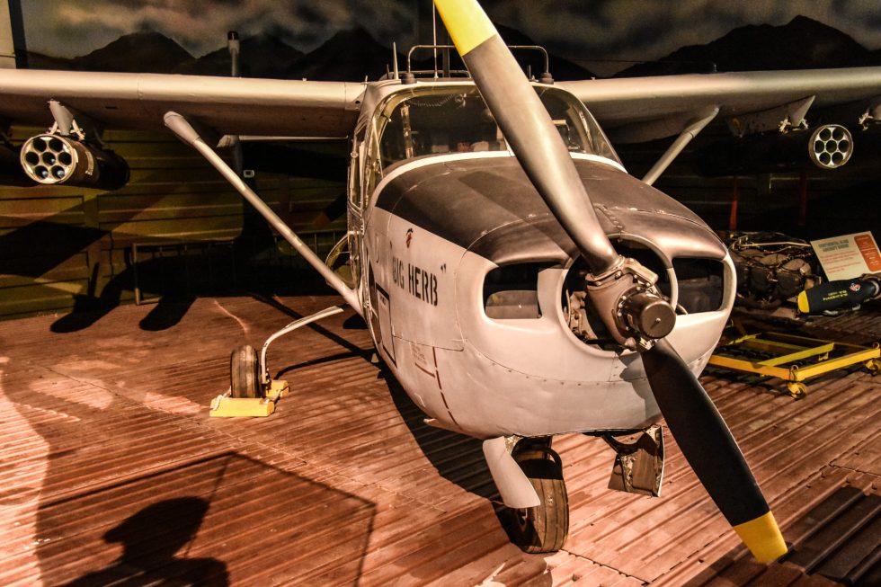 Close-up of the rear pusher engine and propeller of a Cessna O-2 Skymaster, the aft half of its centerline-thrust layout