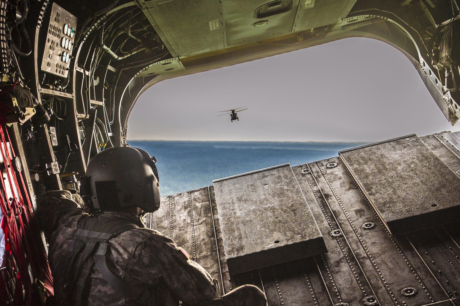 Flight engineer on the rear ramp of a CH-47F Chinook