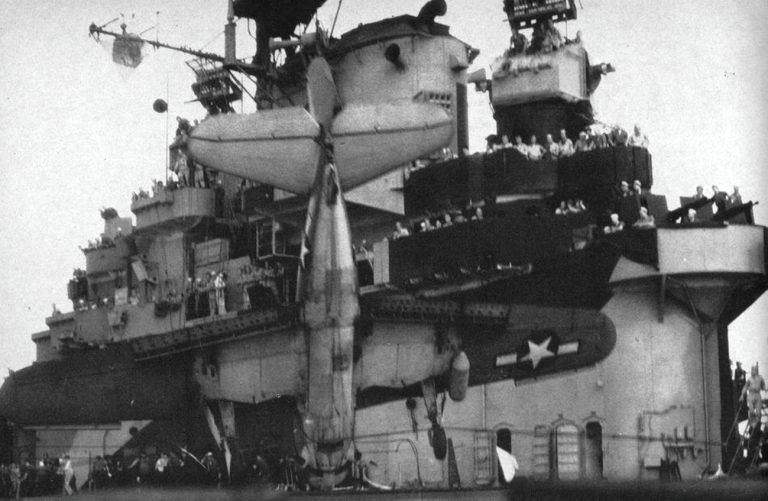 A Curtiss SB2C Helldiver caught in the arrester wires on a carrier