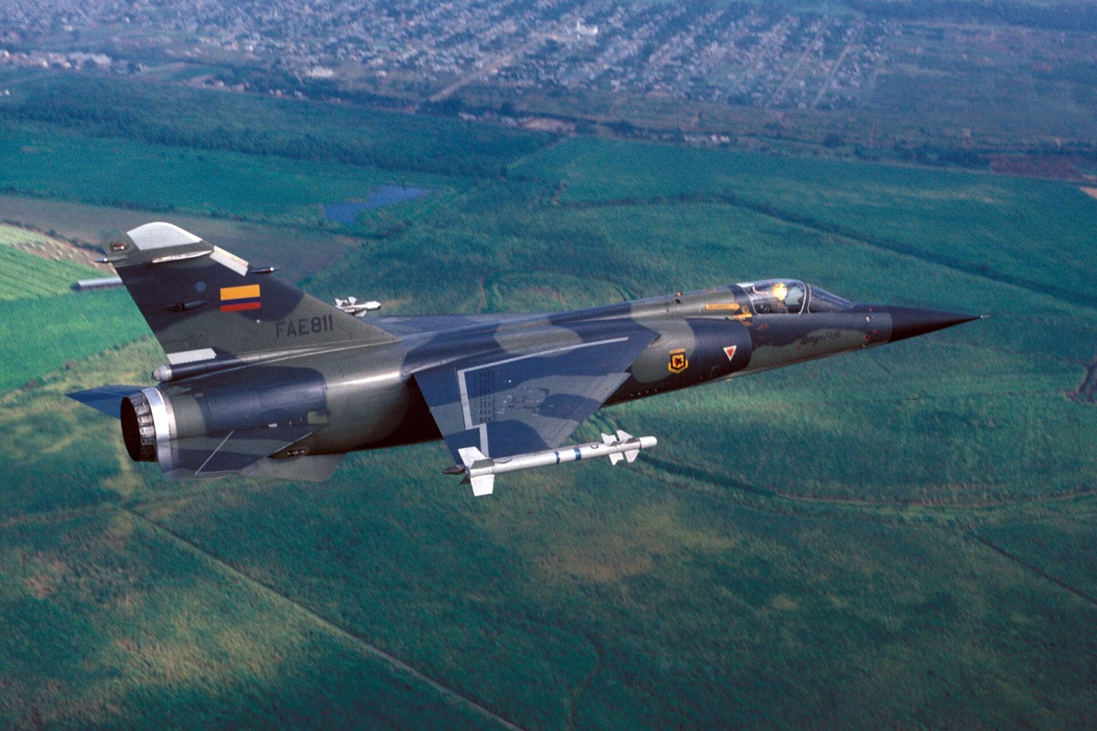 Dassault Mirage F1 fighter in flight over terrain