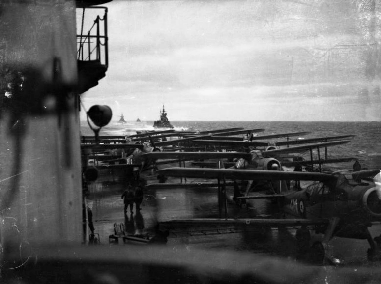 View from the search-light platform over the flight deck of HMS Victorious with Albacores ranged aft, 1944. Photo: Lt C. H. Parnall, RN official photographer &mdash; IWM (public domain).