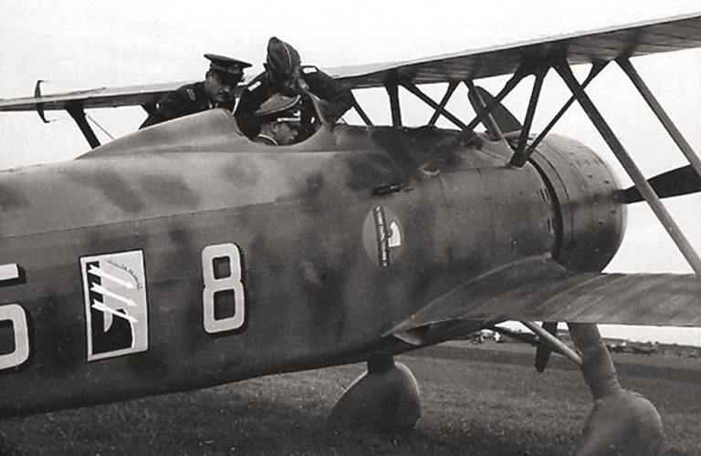 A German officer in the cockpit of a captured Fiat CR.42 in Belgium