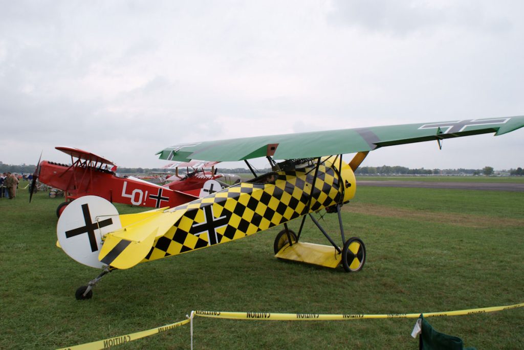A D.VIII (front) displayed with a Fokker D.VII and a Dr.I triplane — three generations of