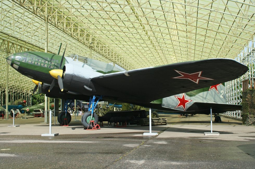 Side profile of a preserved Il-4 in green camouflage with red star.