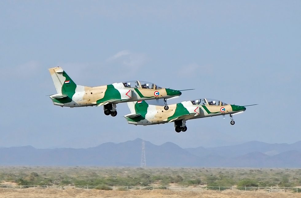 A Sudanese Air Force JL-8 / K-8 over the desert  a trainer flown as a light attacker.