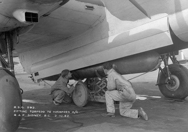 Ground crew loading a torpedo into a Handley Page Hampden