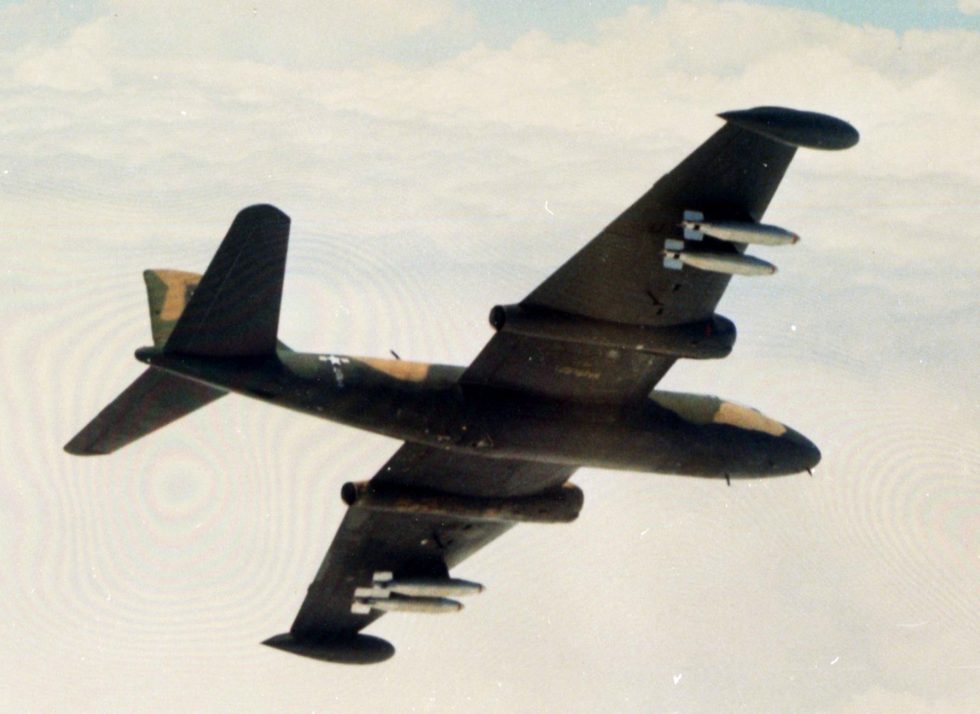 A Martin B-57B Canberra of the 8th Bomb Squadron carrying napalm tanks over Vietnam, 1969.
