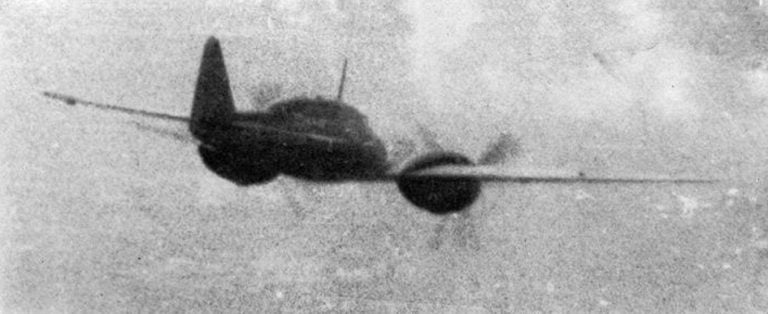 A Ki-46 caught in flight over Bougainville in November 1943, pursued by a US Navy Hellcat.