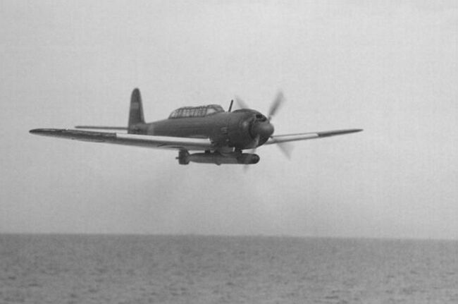 A Tenzan banking on a torpedo run  the long greenhouse canopy is clearly visible.