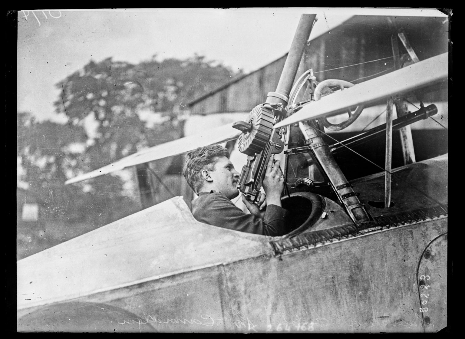 Canadian ace Billy Bishop at an aircraft machine gun