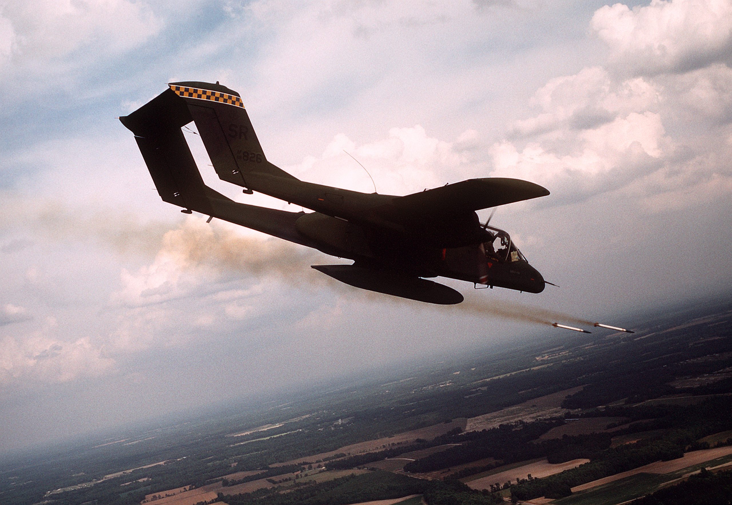 North American OV-10A Bronco firing rockets in flight