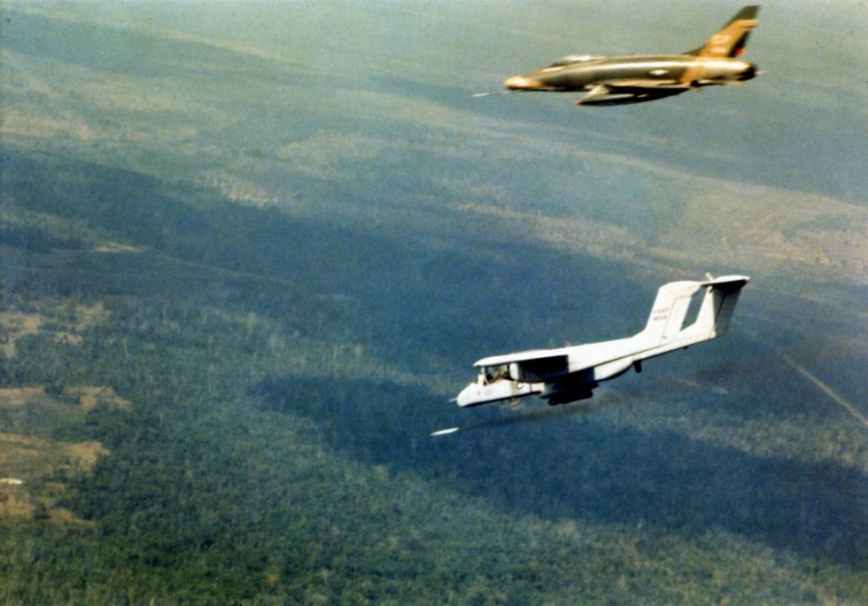 An OV-10A marks a ground target with smoke for a strike aircraft over Vietnam, 1969 the classic forward-air-control mission.