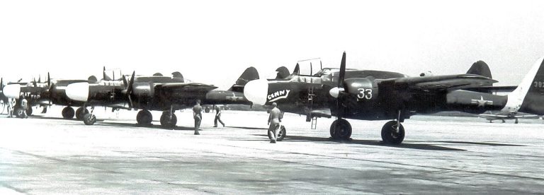 Line of P-61 Black Widow night fighters on a ramp