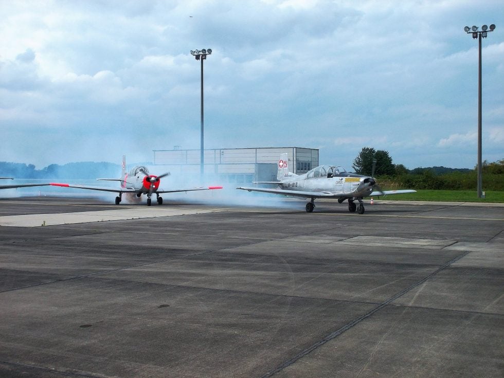A pair of Swiss Air Force P-3s together  the backbone of basic training for decades.