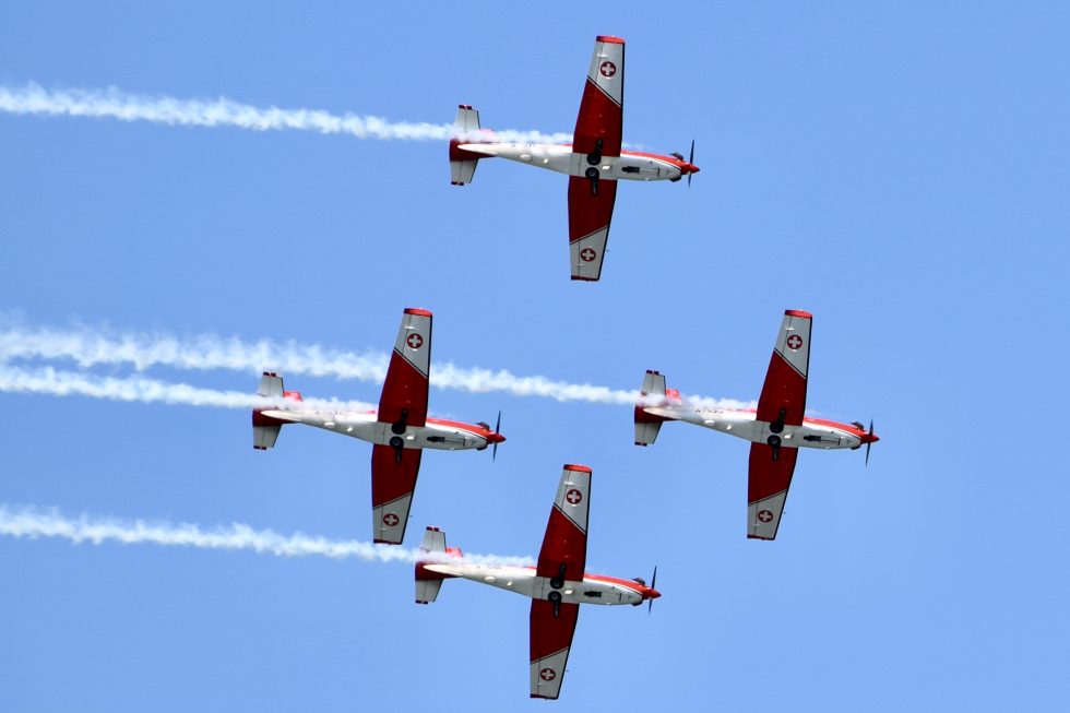 The PC-7 TEAM in a tight formation pass, undersides to the crowd over Payerne.