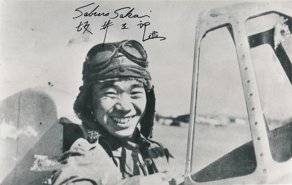 Japanese naval aviator Saburo Sakai standing with a Mitsubishi A5M fighter in 1939