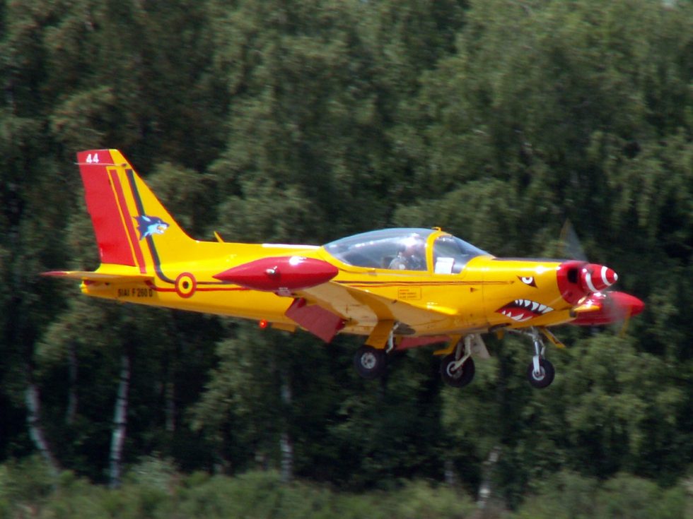 An SF-260 at Kleine Brogel Air Base, Belgium decades on the flight line.