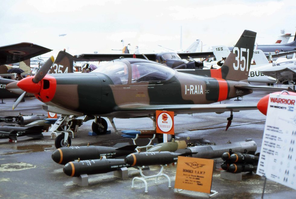 A SIAI-Marchetti SF.260 showing Fratis clean lines and wingtip tanks.