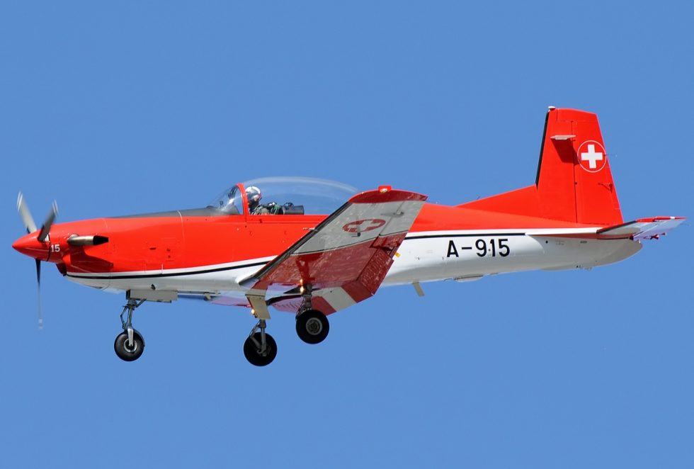 A Swiss Air Force Pilatus PC-7 Turbo Trainer in the classic red-and-white training scheme.
