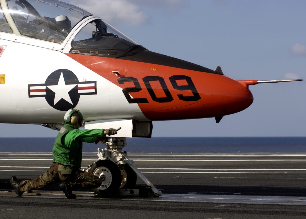 A U.S. Navy T-45 Goshawk in flight over the Atlantic  subsonic, unarmed, built to teach.