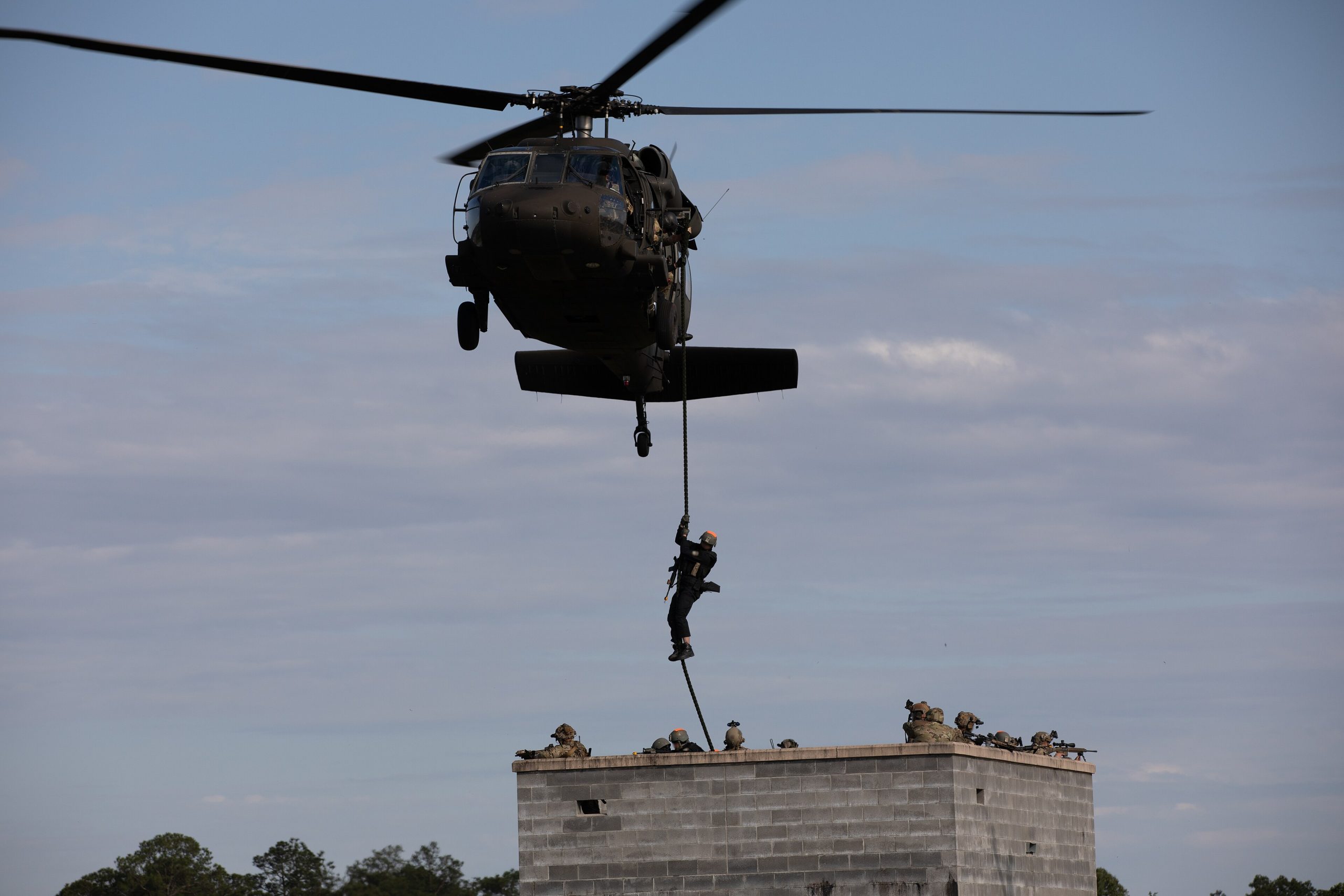 Troops fast-roping from a UH-60 Black Hawk