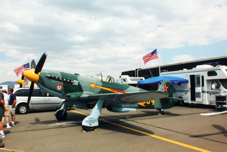Restored Yakovlev Yak-9 parked on an airshow flightline