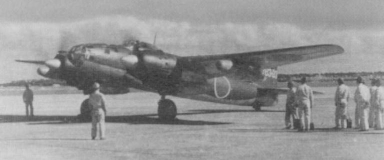 A Ginga with ground crew  the scale of the clean twin-engine airframe is clear.